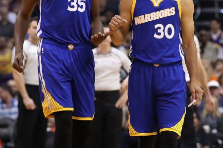 Kevin Durant #35 and Stephen Curry #30 of the Golden State Warriors  (Photo by Christian Petersen/Getty Images)