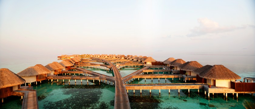 An aerial view of the retreat jetty at night (Courtesy W Maldives)