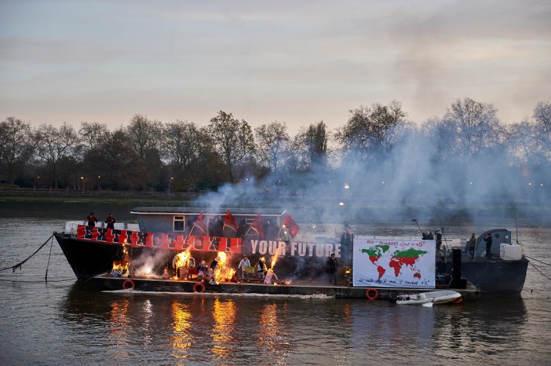 Son of Vivienne Westwood and Sex Pistols creator Malcolm McLaren, Joe Corre, burns his collection of punk memorabilia on a boat moored on the river Thames next to Chelsea Embankment in London (NIKLAS HALLE'N/AFP/Getty Images)