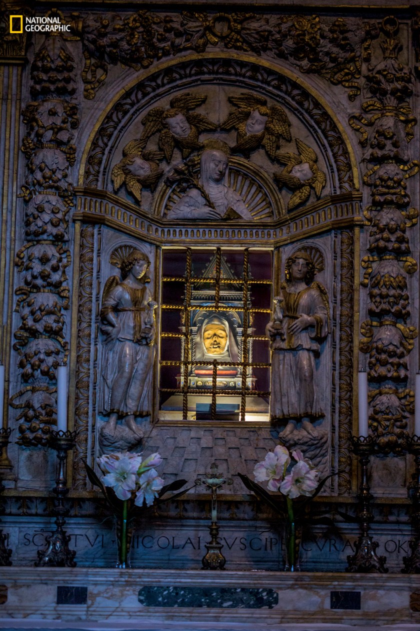 In Siena, Italy, at the Basilica Cateriniana San Domenico, the shrine of St. Catherine, which includes her mummified head, beckons to Roman Catholic pilgrims seeking cures. “If you have doubt,” says local guide Chiara Biccellari, “you will receive nothing.” (Erika Larsen/National Geographic)