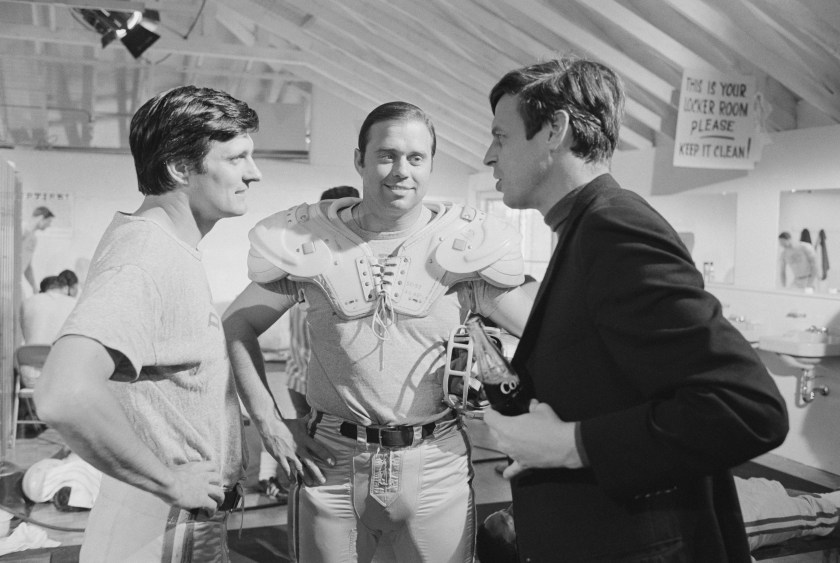 Author George Plimpton confers with Alan Alda on the set of the 1968 comedy Paper Lion, a film adaptation of Plimpton's best-selling book. (Bettmann/Getty Images)