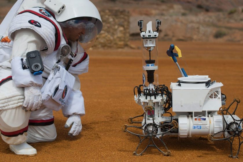 Colombian astronaut Diego Urbina tests the Gandolfi 2 spacesuit as he looks at 'Yemo' robot during the Moonwalk project's first Mars mission simulation in the southwestern Spanish town of Minas de Riotinto, Huelva province, on April 22, 2016. (Jorge Guerrero/AFP/Getty Images)