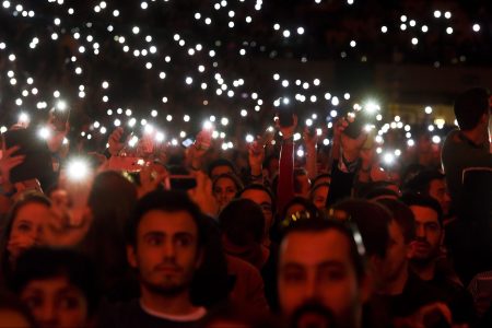 Web Summit's attendees light up the flash lights of their phones at the main stage during the Web Summit at Parque das Nacoes, in Lisbon on November 9, 2016.
Europe's largest tech event Web Summit will be held at Parque das Nacoes in Lisbon from November 7 to 10, 2016. (Patricia De Melo Moriera/AFP/Getty Images)