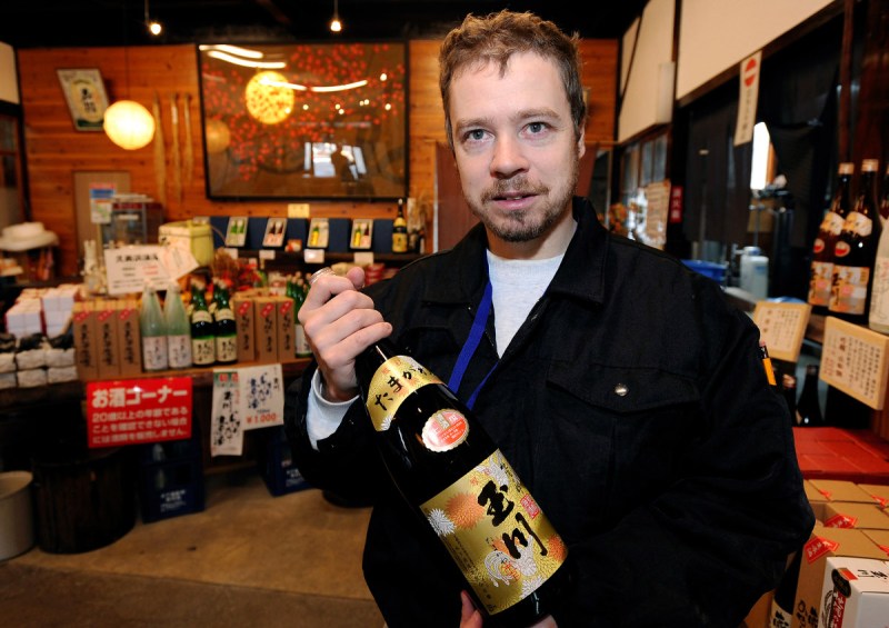 Master sake brewer Philip Harper from the United Kingdom holds a bottle of sake at the Tamagawa Sake Brewery in Kyoto, Japan (Robert Gilhooly/Bloomberg via Getty Images)