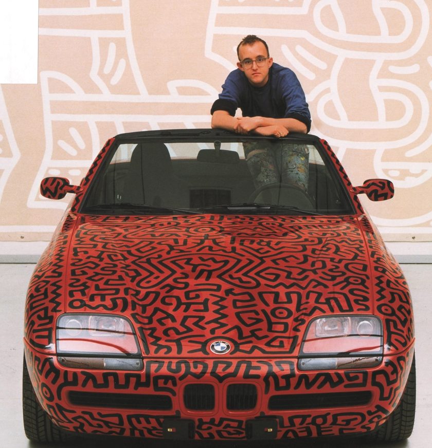 Haring posing with the 1991 BMW Z1 (Keith Haring Foundation/Petersen Automotive Museum)