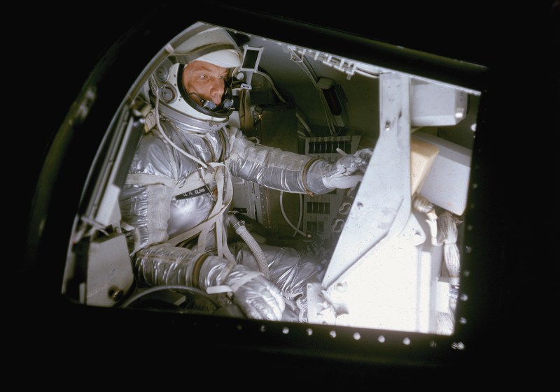 American astronaut (and future politician) John Glenn practices, in a full flightsuit, in a mock Project Mercury space capsule, Langley Research Center, Virginia, 1959. (Photo by Ralph Morse/The LIFE Picture Collection/Getty Images)