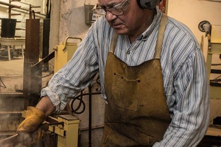 John Dittmeier, Blacksmith, performs a series of straightening and bending after using a power hammer. (April Greer/Washington Post/Getty Images)