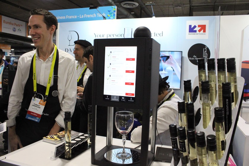 10 Vins co-founder Thibaut Jarrousse shows off the French startup's second-generation D-Vine tech 'sommelier' during the Consumer Electronics Show (CES) on January 7, 2017 in Las Vegas, Nevada. The swirl of technology at the Consumer Electronics Show seeped into all aspects of modern life, even happy hour. Those inspired to reach for a cocktail after navigating seemingly endless CES show floors packed with dizzying displays and throngs of gawkers and talkers were in luck... there were gadgets for that. (Glenn Chapman/AFP/Getty Images)