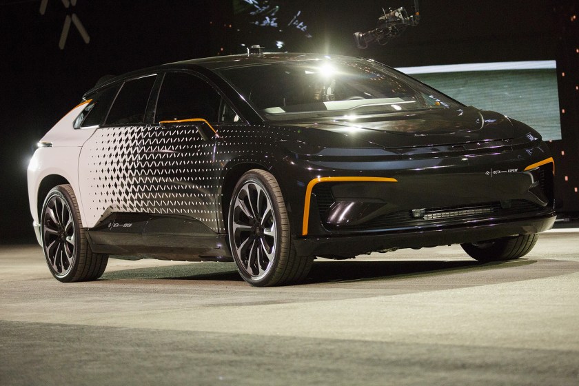 The Faraday Future FF91 electric car is unveiled at the 2017 Consumer Electronics Show (CES) in Las Vegas, Nevada, U.S., on Tuesday, Jan. 3, 2017. Faraday Future staked its claim to the world's fastest electric car with its FF91 production model, showing footage of it outracing Tesla Motors Inc.'s Model S in a glitzy event in Las Vegas. (Patrick T. Fallon/Bloomberg via Getty Images)