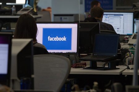 Facebook Inc. employees work at the company's new campus in Menlo Park, California, U.S. (David Paul Morris/Bloomberg via Getty Images)