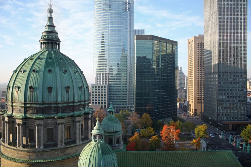 Autumn picture of the dome of the "Cathedrale Marie-Reine-du-monde" and modern highrise office buildings in Montreal, Canada. (Getty Images)