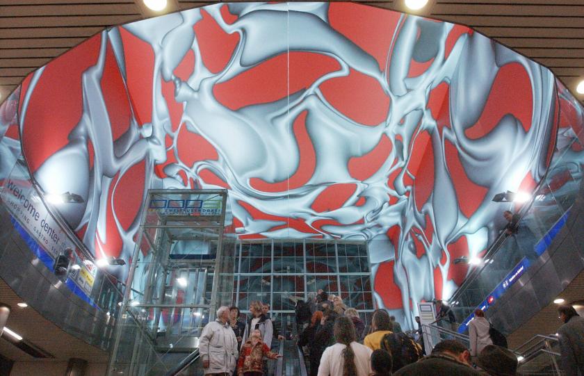 Visitors go into the arrival hall of the newly renovated railway station where painting by Peter Kogler are exhibited in Graz 9 October 2003. (Joe Klamar/AFP/Getty Images)