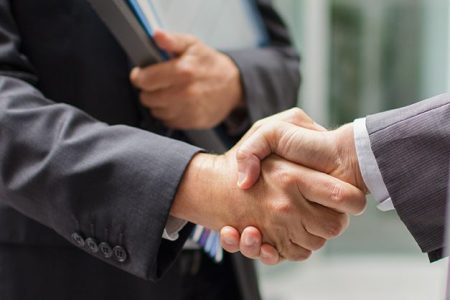 Businessmen shaking hands (Getty Images)