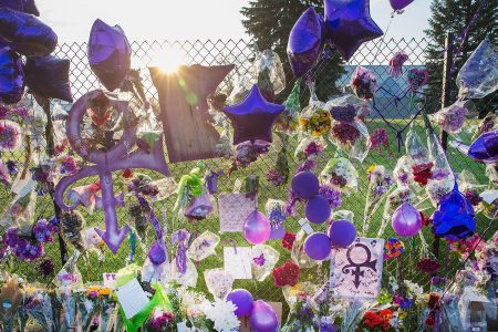 Mementos left by fans are attached to the fence which surrounds Paisley Park, the home and studio of Prince, on April 23, 2016 in Chanhassen, Minnesota. Prince, 57, was pronounced dead shortly after being found unresponsive April 21 in an elevator at Paisley Park.  (Scott Olson/Getty Images)