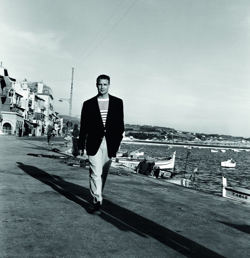 Marlon Brando walking along the harbor in Bandol in 1954. (Riviera Cocktail, Edward Quinn - Côte d'Azur Jet Set of the 1950s, Small Format Edition, to be published by teNeues)