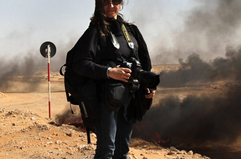 New York Times photographer Lynsey Addario stands near the frontline during a pause in the fighting March 11, 2011 in Ras Lanuf, Libya. (John Moore/Getty Images)