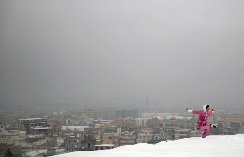 A Shaolin Wushu martial arts student practices on a hilltop in Kabul, Afghanistan, Tuesday, Jan. 25, 2017, preparing for the day that Afghanistan can send its women’s team to the Shaolin world championship in China.(AP Photos/Massoud Hossaini)