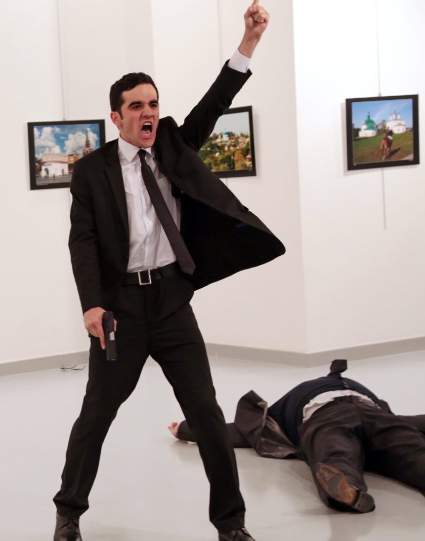 World Press Photo of the Year: Mevlut Mert Altintas shouts after shooting Andrei Karlov, right, the Russian ambassador to Turkey, at an art gallery in Ankara, Turkey, Monday, Dec. 19, 2016. (AP Photo/Burhan Ozbilici)