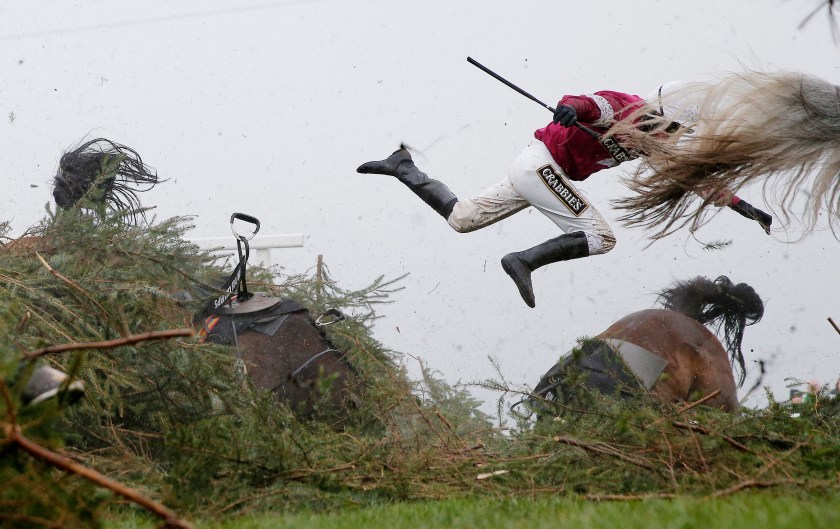 Sports - First Prize, Singles: Jockey Nina Carberry flies off her horse Sir Des Champs as they fall at The Chair fence during the Grand National steeplechase during day three of the Grand National Meeting at Aintree Racecourse on April 9th 2016 in Liverpool, England. (Tom Jenkins/The Guardian)