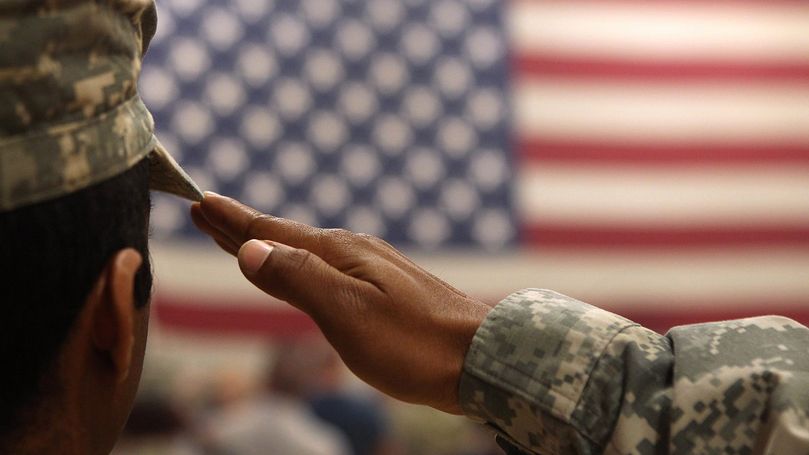 A soldier salutes the flag during a welcome home ceremony for troops arriving from Afghanistan on June 15, 2011 to Fort Carson, Colorado. More than 500 soldiers from the 1st Brigade Combat Team returned home following a year of heavy fighting and high casualties in Afghanistan's southern Kandahar province.  (John Moore/Getty Images)