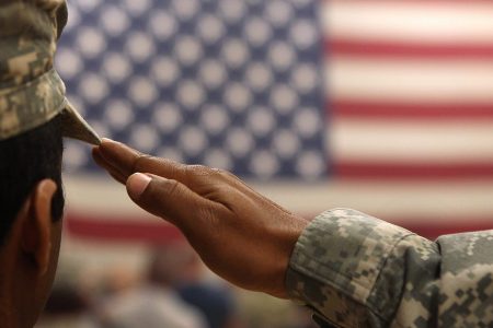 A soldier salutes the flag during a welcome home ceremony for troops arriving from Afghanistan on June 15, 2011 to Fort Carson, Colorado. More than 500 soldiers from the 1st Brigade Combat Team returned home following a year of heavy fighting and high casualties in Afghanistan's southern Kandahar province.  (John Moore/Getty Images)