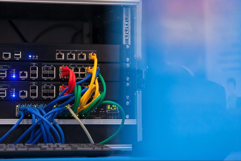 Data cables in red, yellow, green and blue are seen attached to a Dell SonicWall NSA 5600 firewall unit, produced by Dell Inc., on display at the CeBit tech show in Hanover, Germany, on Monday, March 16, 2015. European Commission and EIB plan to accelerate upgrades to telecommunications networks by subsidizing construction in rural areas, Guenther Oettinger, commissioner for the digital economy, says at CeBIT conference in Hanover. (Krisztian Bocsi/Bloomberg via Getty Images)