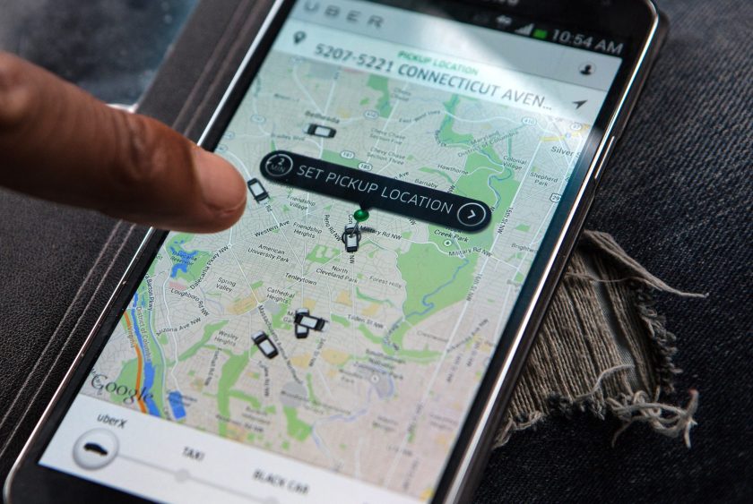 WASHINGTON, DC - APR 4: UberX driver, Michael Belet, checks the Uber customer app to see where other Uber drivers are working so he can determine where the best place for him to get fares might be, April 7, 2014, in Washington, DC. Thousands of local car owners have signed up in recent months to drive with one of the "ride-share" operators that use smartphone apps to link people needing rides with car owners willing to give them, for a price. (Evelyn Hockstein/For The Washington Post via Getty Images)