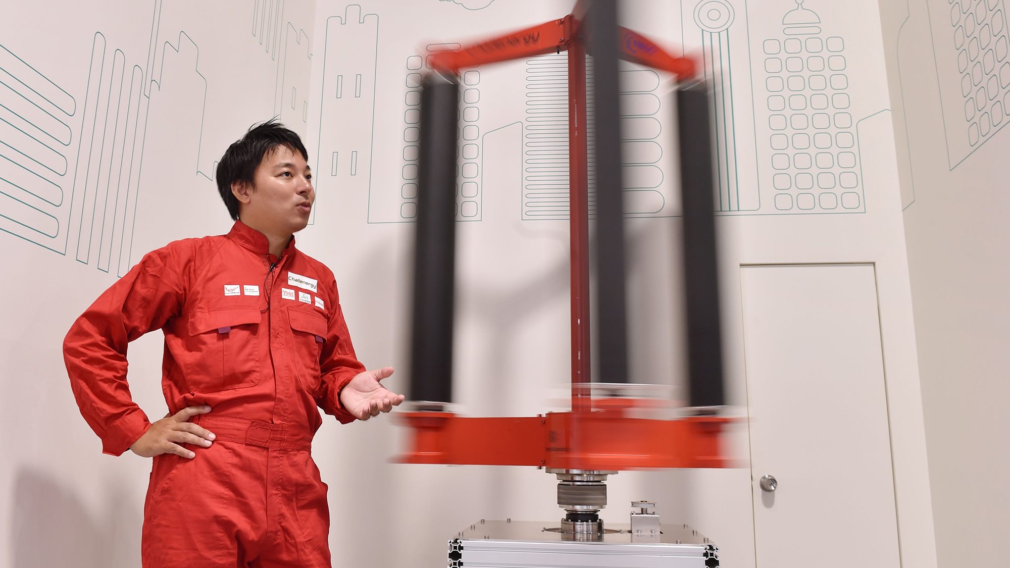 This picture taken on October 20, 2016 shows engineer Atsushi Shimizu, founder and CEO of the Japanese venture company Challenergy, standing next to his bladeless wind turbine in Tokyo.
The amount of electricity produced by wind nearly doubled in 2016 from a year earlier, according to a recent survey by the Japan Wind Power Association. But wind power's share of Japan's total energy mix is still less than one percent. / AFP PHOTO / Kazuhiro NOGI / TO GO WITH Japan-energy-environment,FOCUS by Harumi Ozawa        (Photo credit should read KAZUHIRO NOGI/AFP/Getty Images)