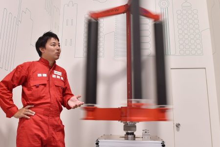 This picture taken on October 20, 2016 shows engineer Atsushi Shimizu, founder and CEO of the Japanese venture company Challenergy, standing next to his bladeless wind turbine in Tokyo.
The amount of electricity produced by wind nearly doubled in 2016 from a year earlier, according to a recent survey by the Japan Wind Power Association. But wind power's share of Japan's total energy mix is still less than one percent. / AFP PHOTO / Kazuhiro NOGI / TO GO WITH Japan-energy-environment,FOCUS by Harumi Ozawa        (Photo credit should read KAZUHIRO NOGI/AFP/Getty Images)