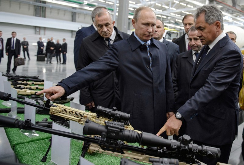  Udmurtia's head Alexander Solovyov, President Vladimir Putin and Defense Minister Sergei Shoigu review the Kalashnikov Concern production (Dmitry Azarov/Kommersant via Getty Images)