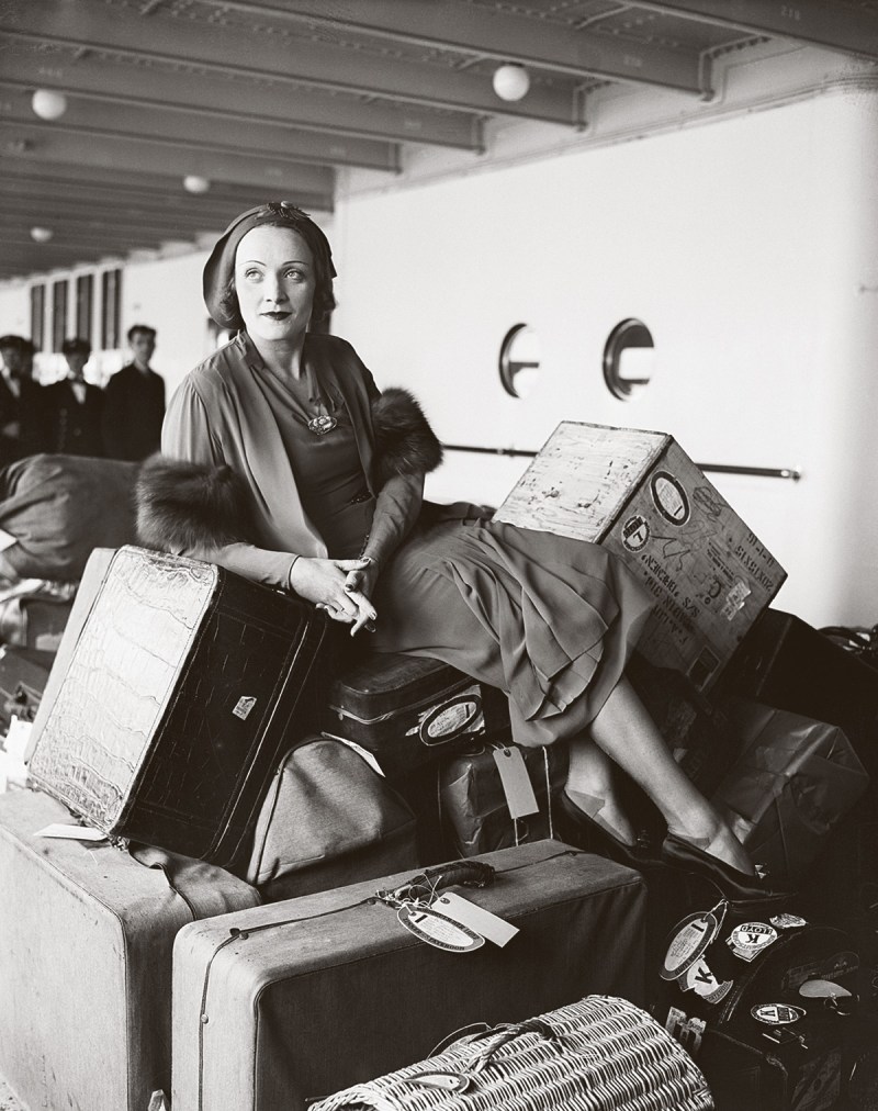 German movie star Marlene Dietrich with a pile of luggage en route to the USA on the ocean liner Bremen, 1931 (Bettmann Archive/Getty Images)