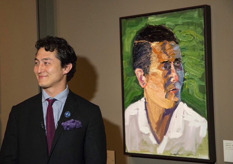 Jay Fain, Jr., US Army Sergeant, stands in front of a painting of him painted by former US President George W. Bush for the "Portraits of Courage" exhibit, a new exhibit at the George W. Bush Presidential Library and Museum in Dallas, Texas, on February 28, 2017. (Laura Buckman/AFP/Getty Images)