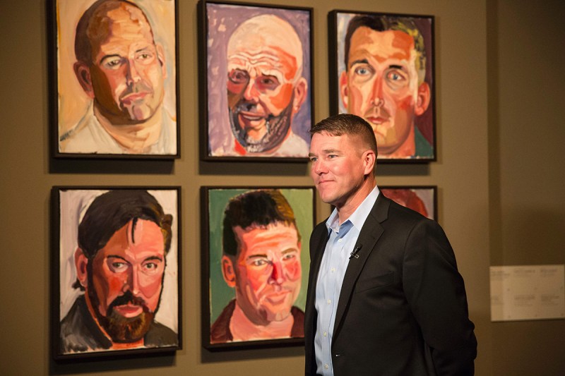 James Williamson, US Air Force Chief Warrant Officer Three, stands in front of a painting of him painted by former US President George W. Bush for the "Portraits of Courage" exhibit, a new exhibit at the George W. Bush Presidential Library and Museum in Dallas, Texas, on February 28, 2017. (Laura Buckman/AFP/Getty Images)