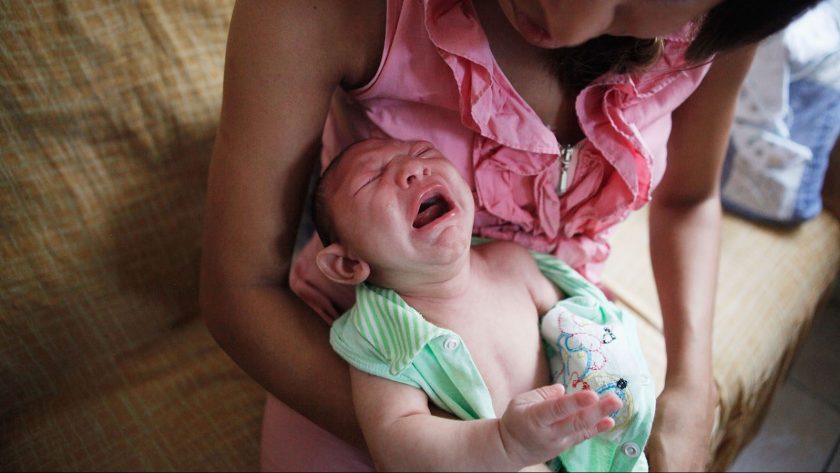 Mother Daniele Santos changes her baby Juan Pedro, 2-months-old, who was born with microcephaly, on February 3, 2016 in Recife, Pernambuco state, Brazil. In the last four months, authorities have recorded thousands of cases in Brazil in which the mosquito-borne Zika virus may have led to microcephaly in infants. Microcephaly results in an abnormally small head in newborns and is associated with various disorders. The state with the most cases is Pernambuco, whose capital is Recife, and is being called the epicenter of the outbreak. (Photo by Mario Tama/Getty Images)