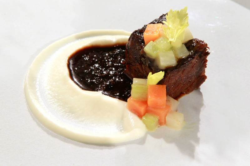 The 'restaurant' presentation of a meal of braised short ribs cooked by Chef Daniel Humm, of Manhattan's Eleven Madison Park, is featured in test kitchen, November 14, 2011, in Chicago, Illinois. 