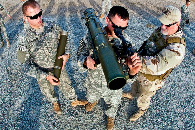 A civilian instructor coaches two paratroopers with the 82nd Airborne Division’s 1st Brigade Combat Team on how to use a Carl Gustav 84mm recoilless rifle during a certification class Dec. 6, 2011, at Fort Bragg, N.C. The multi-role weapon can be used against armor, fortifications and personnel. (U.S. Army photo by Sgt. Michael J. MacLeod)