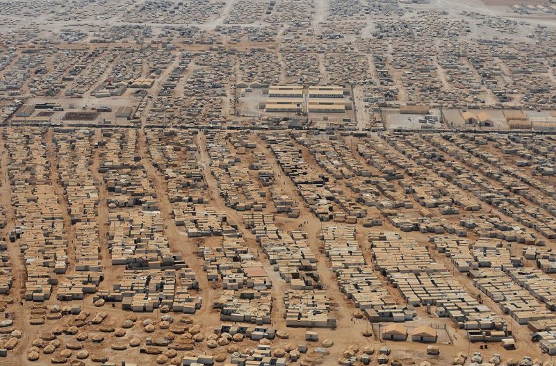 An aerial view shows the Zaatari refugee camp on July 18, 2013 near the Jordanian city of Mafraq, some 8 kilometers from the Jordanian-Syrian border. The northern Jordanian Zaatari refugee camp is home to 115,000 Syrians. (AFP PHOTO/MANDEL NGAN/POOL)