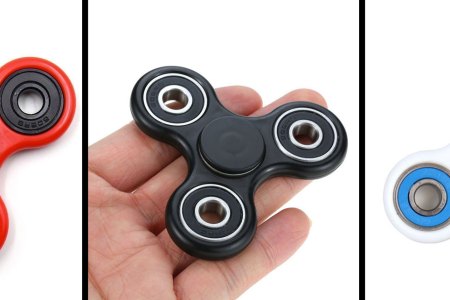 A red, black, and white fidget spinner.