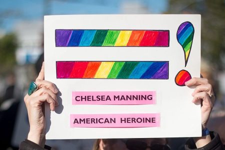 Holly Severson holds up a sign showing support for Chelsea Manning in the Castro District of San Francisco, California on May 17, 2017, during a celebration for Manning's release.