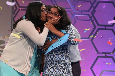 Ananya Vinay of Fresno, CA. gets a kiss from her mom, Anu Pama Poliyedathpp, after winning the 2017 Scripps National Spelling Bee.