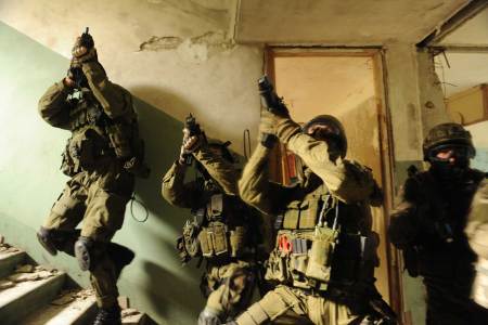 Polish special operations soldiers from the 1st Special Forces Regiment secure a stairwell during a culmination exercise in Trzebien, Poland, Aug. 4, 2010. The soldiers are participating in a partnership development program between Polish, Croatian and U.S. Army special operations units. (DoD photo by Staff Sgt. Isaac A. Graham, U.S. Army/Released)