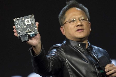 en-Hsun Huang, president and chief executive officer of Nvidia Corp., holds the Nvidia Xavier high-end computing module as he speaks during a keynote presentation at the 2017 Consumer Electronics Show (CES) in Las Vegas, Nevada, U.S., on Wednesday, Jan. 4, 2017. Nvidia, the biggest maker of graphics chips, announced a new version of its Shield set-top box and the debut of an online service designed to bring millions of new consumers to high-end computer games. (David Paul Morris/Bloomberg via Getty Images)