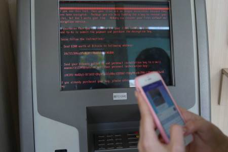 A message demanding money is seen on a monitor of a payment terminal at a branch of Ukraine's state-owned bank Oschadbank after Ukrainian institutions were hit by a wave of cyber attacks earlier in the day, in Kiev, Ukraine, June 27, 2017. (REUTERS/Valentyn Ogirenko )