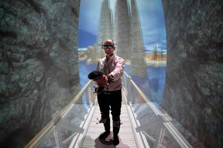 French patient Denis Duet wearing a virtual reality (VR) headset undergoes a VR therapy session called "CtrlStress" at the laboratory of the Institut des Sciences du Mouvement (The Institute of Movement Sciences) in Marseille on January 26, 2016.
Since 2012, Doctor Eric Malbos has been using virtual reality sessions at the institute as a form of treatment for patients suffering from phobias like claustrophobia and acrophobia. (Boris Horvat/AFP/Getty Images)