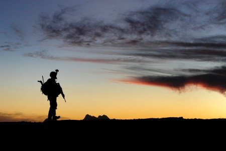 A U.S. Soldier with Charlie Company, 1st Battalion, 17th Infantry Regiment marches back to the Joint District Community Center after fortifying a combat outpost , Rajankala, Kandahar Province, Afghanistan, Nov. 26, 2009. The U.S. Army operates from combat outposts to add flexibility to operations in their sectors (U.S. Air Force photo by Tech. Sgt. Francisco V. Govea II/Released)