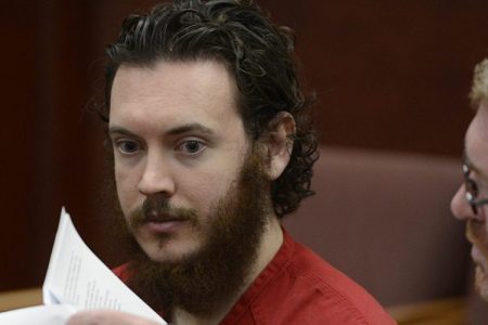 James Holmes looks over advisement papers along with his attorney, Daniel King, during a hearing Tuesday morning June 04, 2013 at the Arapahoe County Justice Center. Holmes is accused of killing 12 people and injuring 70 others in a shooting rampage at an Aurora theater, July 20th, 2012. The court accepted James Holmes plea of not guilty by reason of insanity and has ordered a sanity evaluation at the Colorado Mental Health Institute of Pueblo.