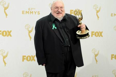 Writer George R. R. Martin, seen here with his Outstanding Drama Series for Emmy 'Game of Thrones' in 2015, could release the next installment in 2018. (Michael Kovac/Getty Images for AXN)