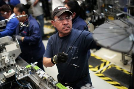 At work in the auto parts production line in the Bosch factory in San Luis Potosi, Mexico, on January 11, 2017.
US President Donald Trump has threatened to impose a 35 percent import tariff on companies that ship jobs to Mexico. (Pedro Pardo/AFP/Getty Images)