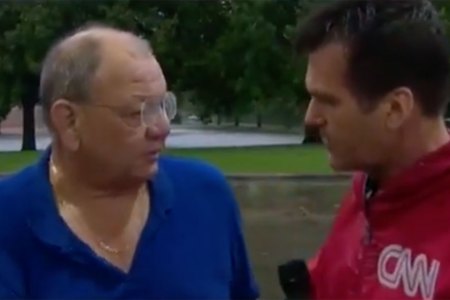 A CNN reporter rescued Jerry Sumrall from rising flood waters in Beaumont, Texas. (CNN/YouTube)