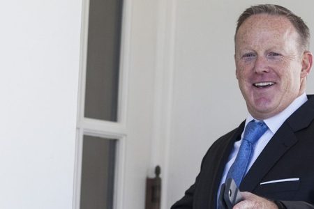 Sean Spicer, outgoing White House press secretary, gestures while entering the West Wing of the White House in Washington, D.C., U.S., on Tuesday, July 25, 2017.